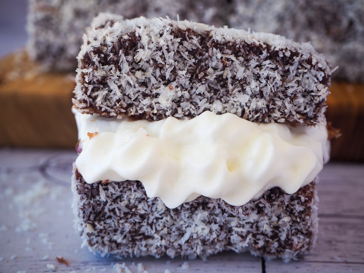 Lamingtons 39 Close up lamington filled with jam and cream.