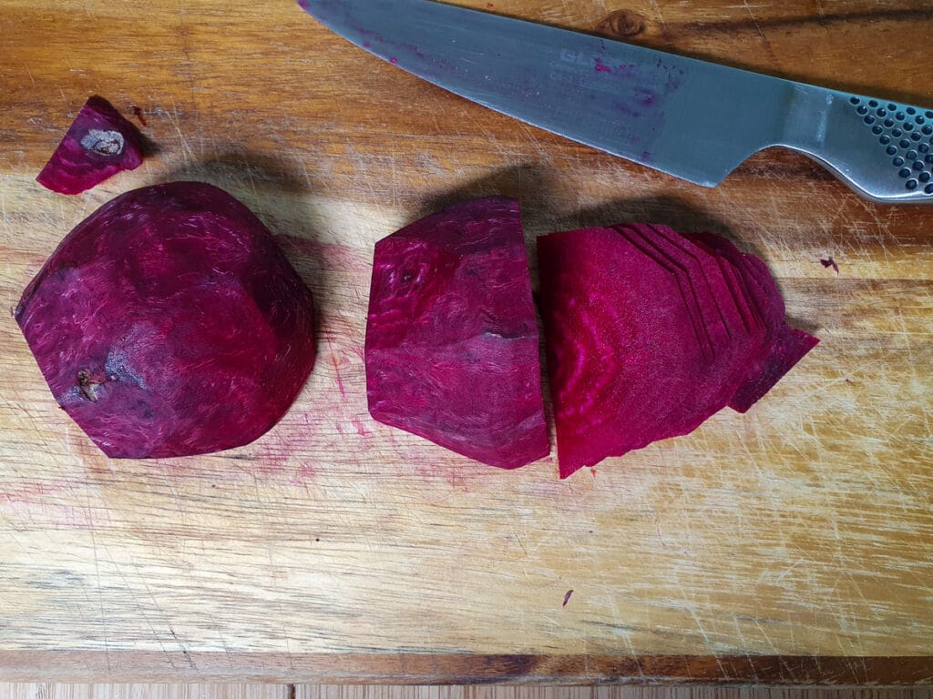 Refrigerator pickled beets 10 Thinly slicing peeled beets with a sharp knife.