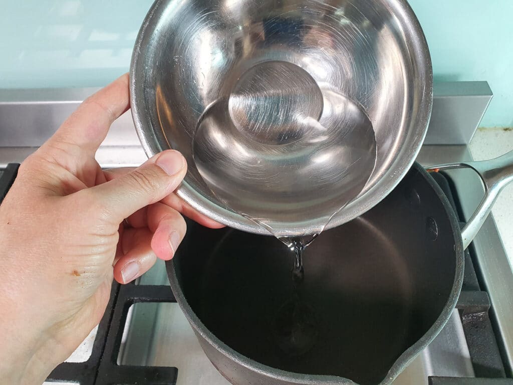 Refrigerator pickled beets 4 Adding vinegar to pot on stove.