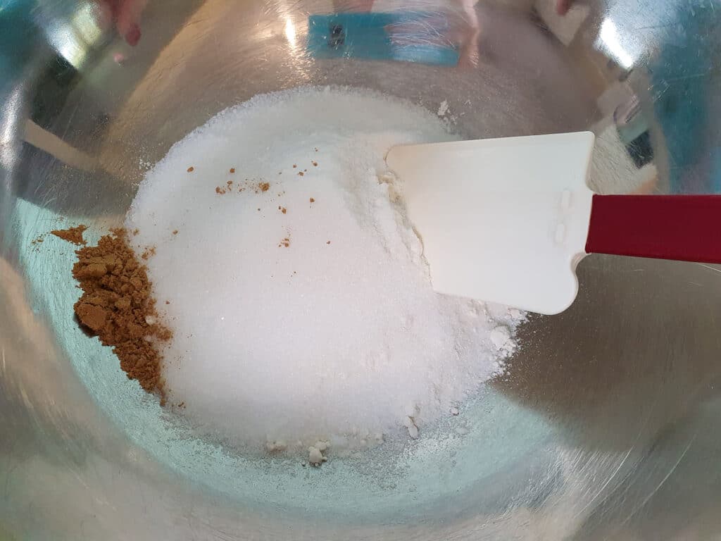 Ginger crunch 9 Stirring dry ingredients before adding butter to base.