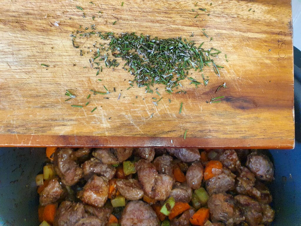 Slow cooker lamb ragu 23 Adding chopped rosemary.