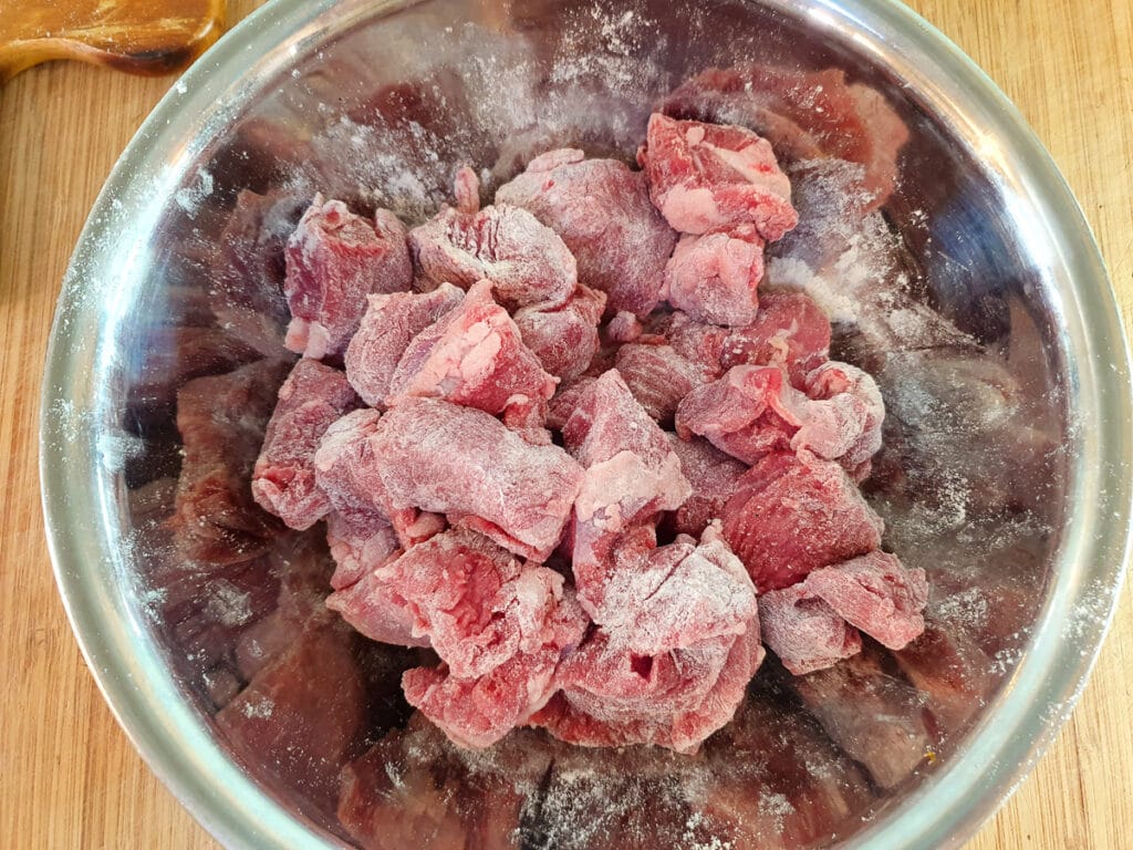 Slow cooker lamb ragu 17 Coating the lamb in seasoned flour.