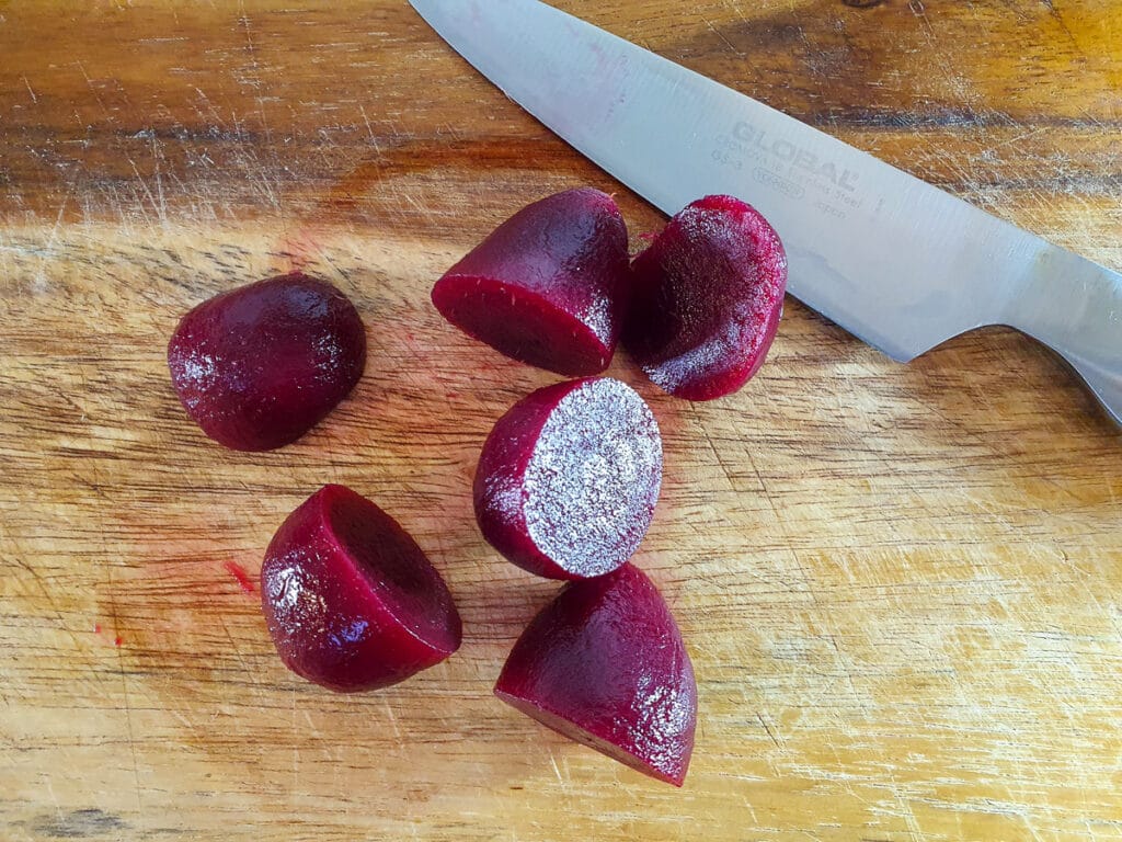 Beetroot salad 5 Chopping up larger baby beetroots into smaller pieces.