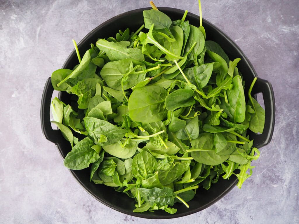 Beetroot salad 8 Adding salad leaves to the salad.