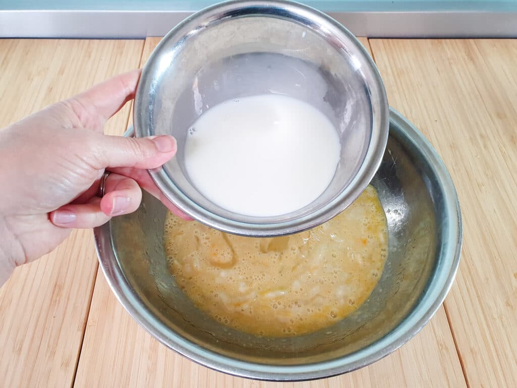 Feijoa loaf 12 Adding milk to mashed feijoas.
