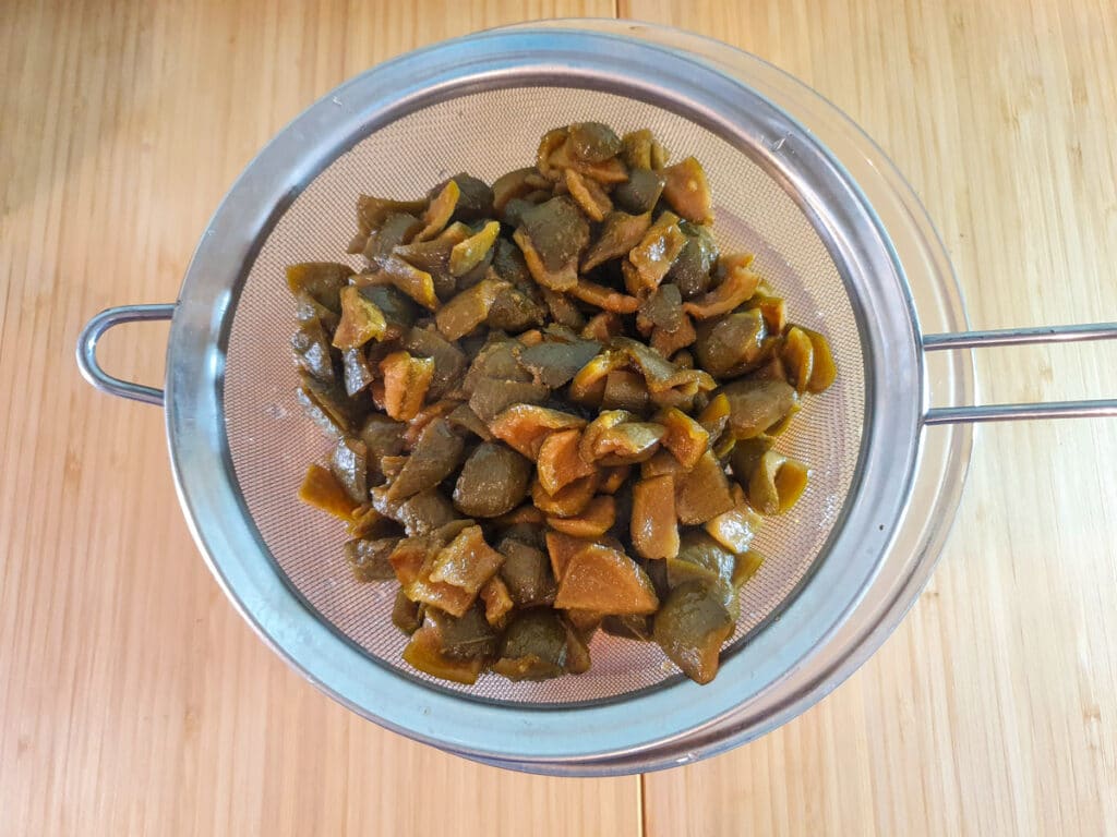 Feijoa syrup 9 Straining syrup.