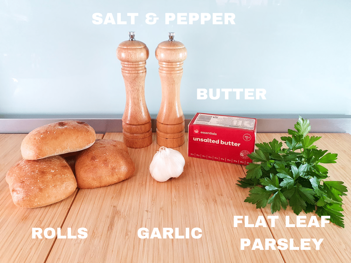 Air Fryer Garlic Bread 3 Air fryer garlic bread ingredients, rolls, salt and pepper, garlic cloves, unsalted butter, flat leaf parsley.
