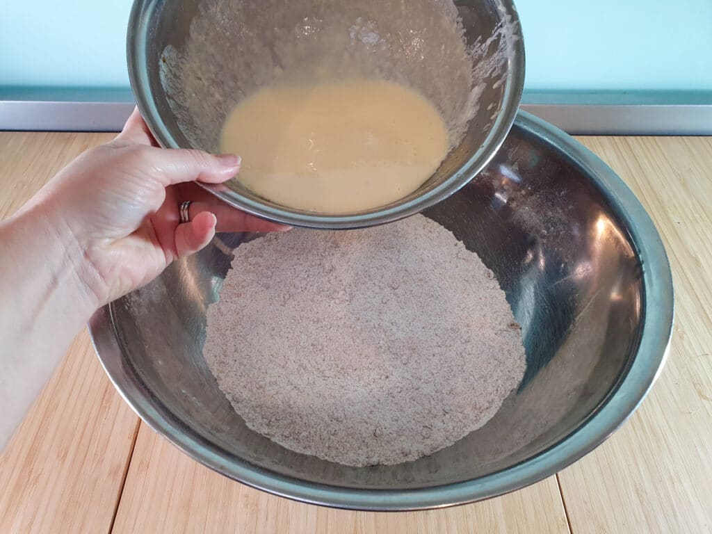 Pear muffins 9 Adding milk mix to dry ingredients.