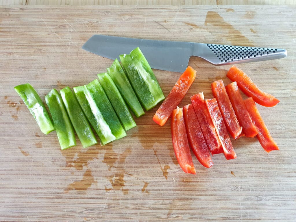 Chilli Chicken Gravy 6 Cutting up the red and green capsicum.
