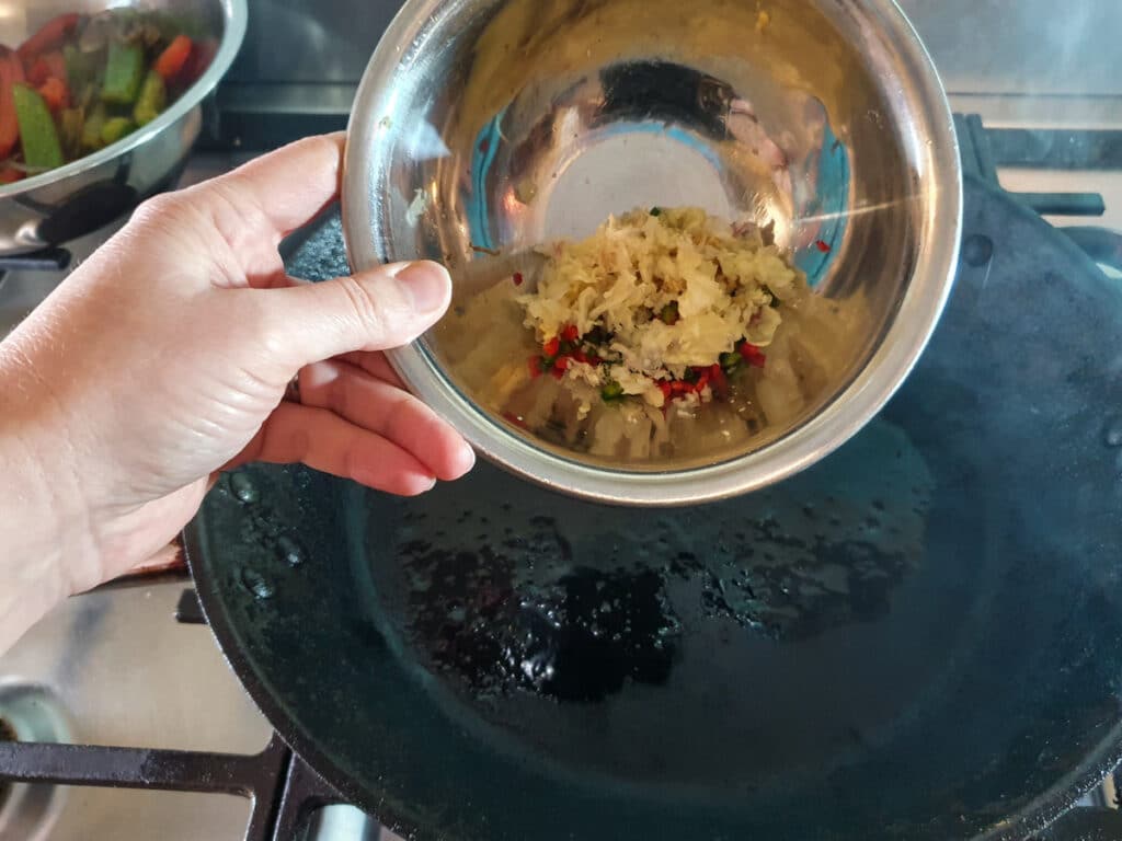 Chilli Chicken Gravy 17 Adding garlic, chilli and ginger to the pan.