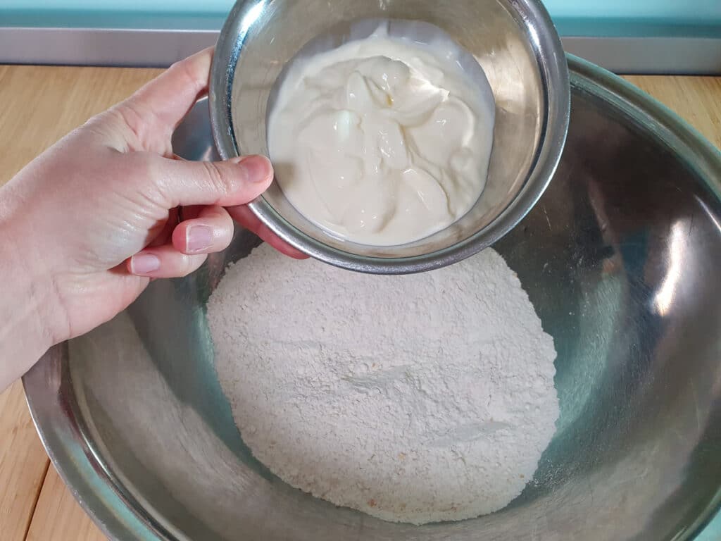 Cheesymite Scrolls 7 Adding yoghurt to flours.