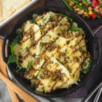 Rocket and Pear Salad 13 Close up salad with serving spoons, pie and four bean salad.