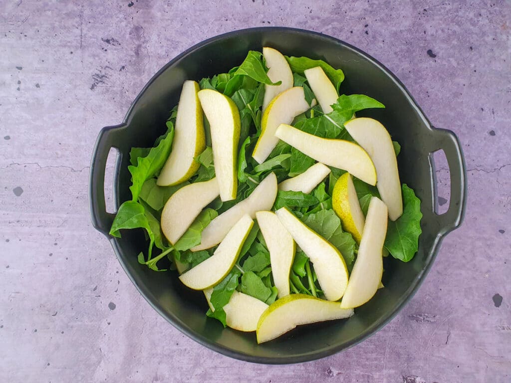 Rocket and Pear Salad 8 Building salad, adding lemony pears.