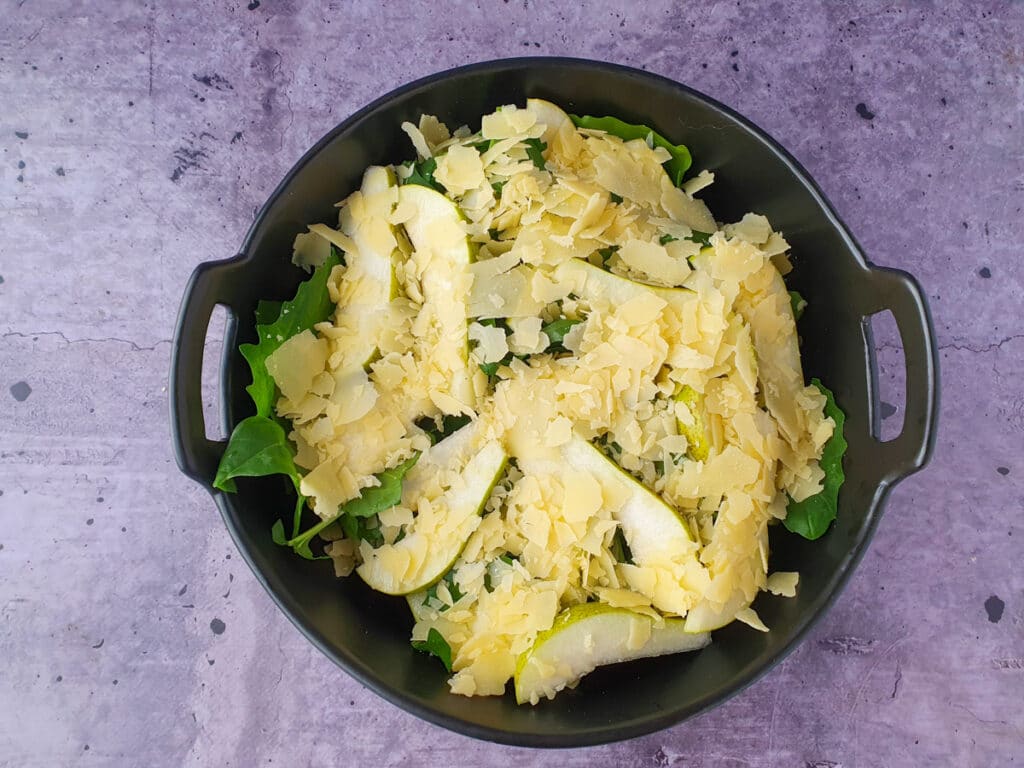 Rocket and Pear Salad 9 Building salad, adding shaved parmesan.