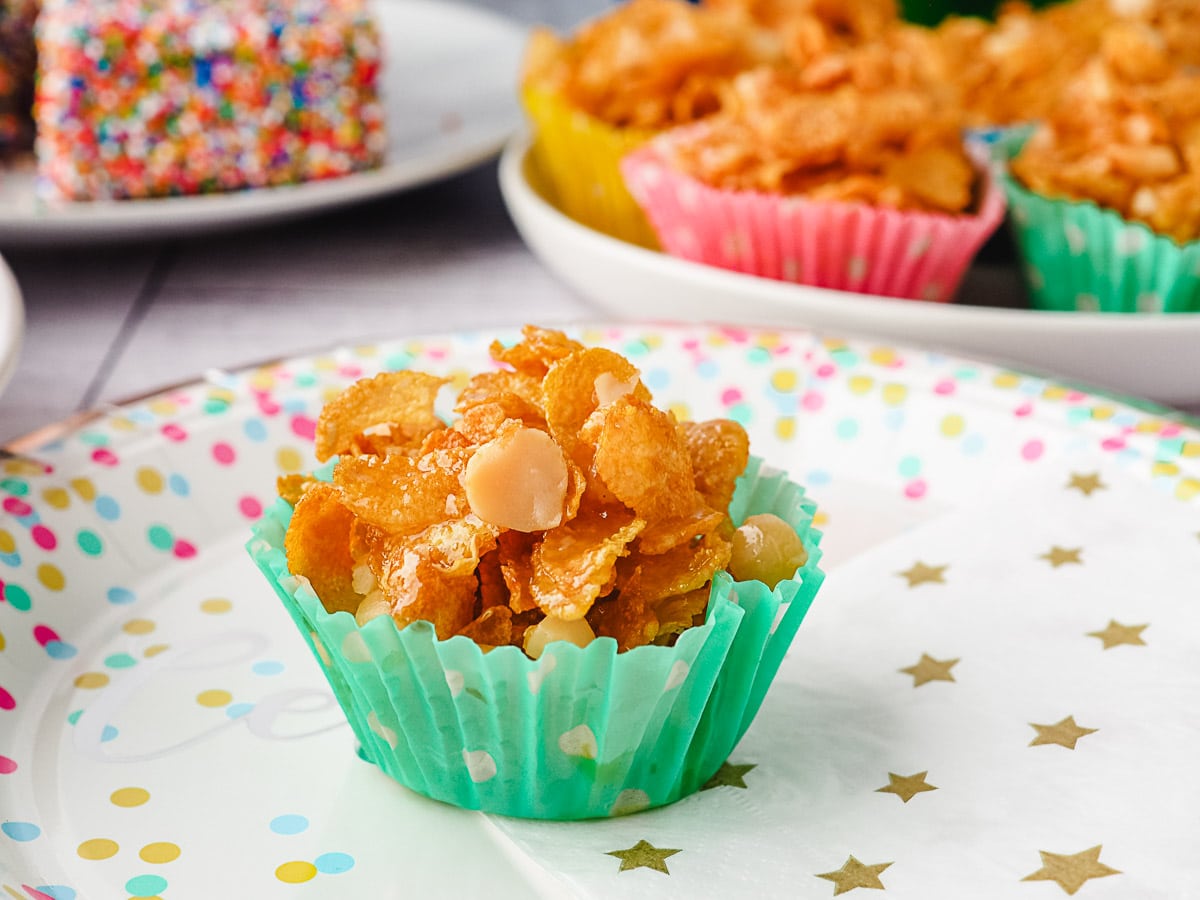 Honey Joys 9 Honey joy on a plate with party food in background.
