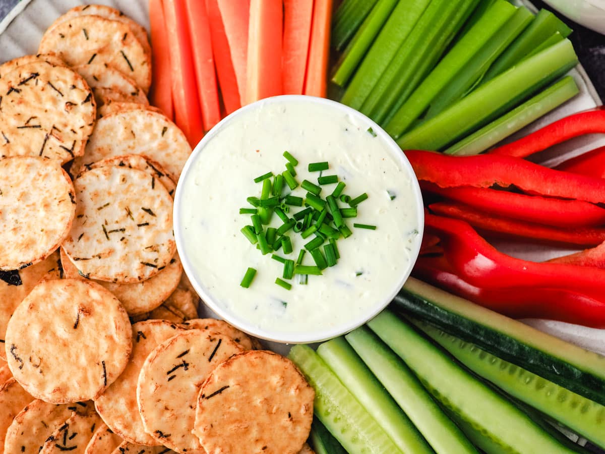 Sour Cream Dip 8 Sour cream dip with veggie sticks, carrots, celery, red pepper and cucumber, and rice crackers.