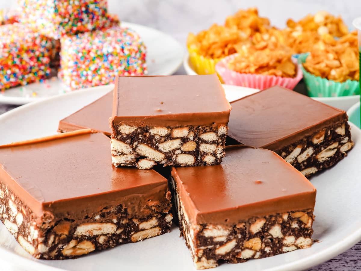 Hedgehog Slice 1 Hedgehog slices on a serving plate with party food in the background.